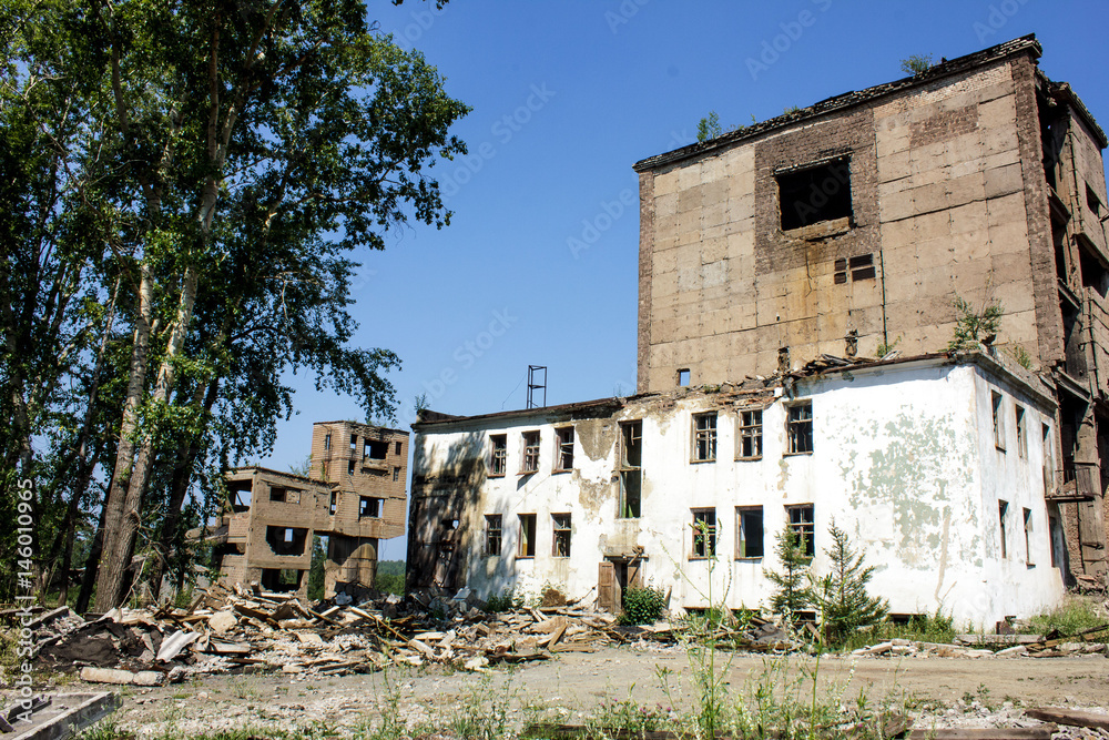 Fototapeta premium Destroyed buildings near an abandoned mine