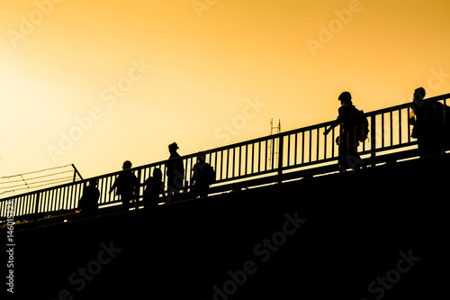 Schilderij op canvas silhouette Myanmar workers crossing border to Thailand, Mae Sot, Tak, Thailand