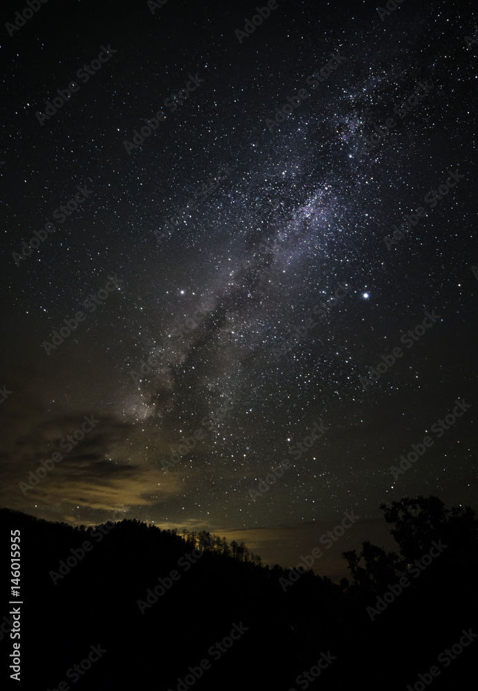 Fotografie Milky way rising over mountains