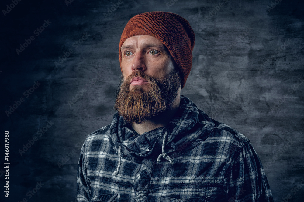 Portrait of bearded male in a hat and fleece shirt. Portrait of bearded male in a hat and fleece shirt.