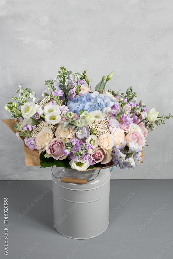 Still life with a bouquet of flowers. the florist put together a beautiful bunch of flowers. Man manual work used different types of flowers and colors. copy space Still life with a bouquet of flowers. the florist put together a beautiful bunch of flowers. Man manual work used different types of flowers and colors. copy space