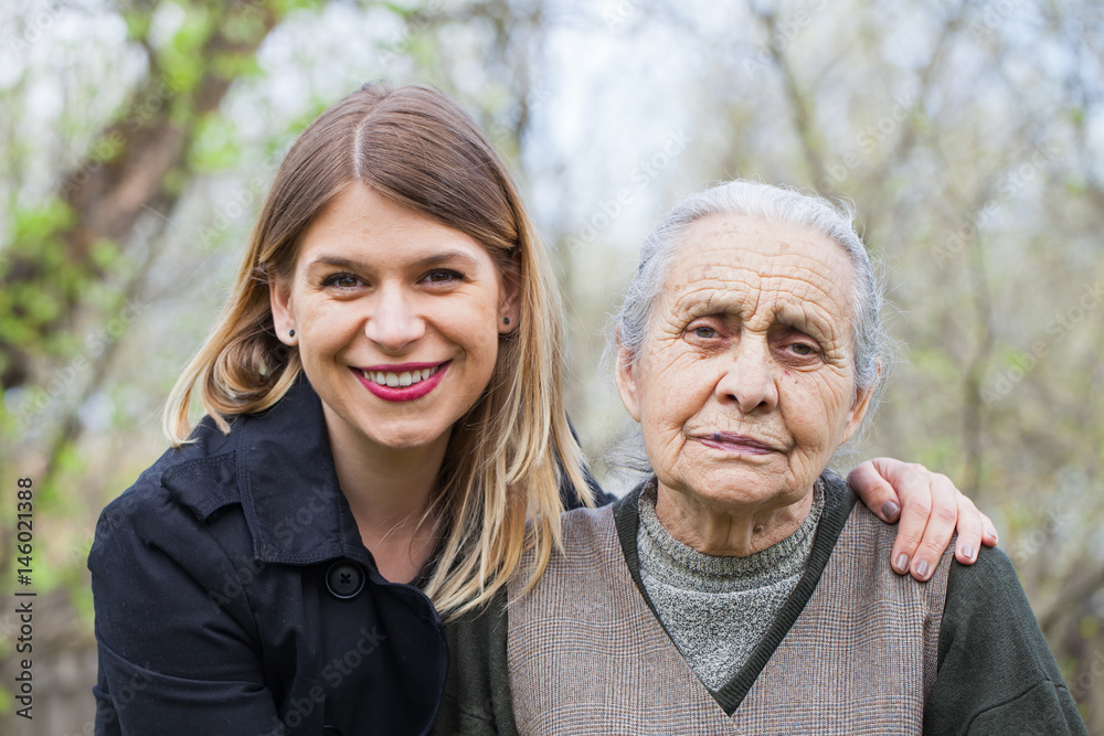 Elderly woman with her carer outdoor Elderly woman with her carer outdoor