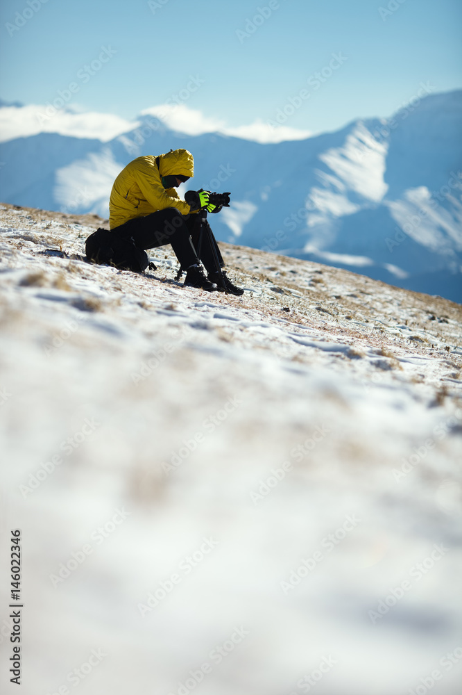 Traveler photographs the landscape in the mountains. Republic of Ingushetia.