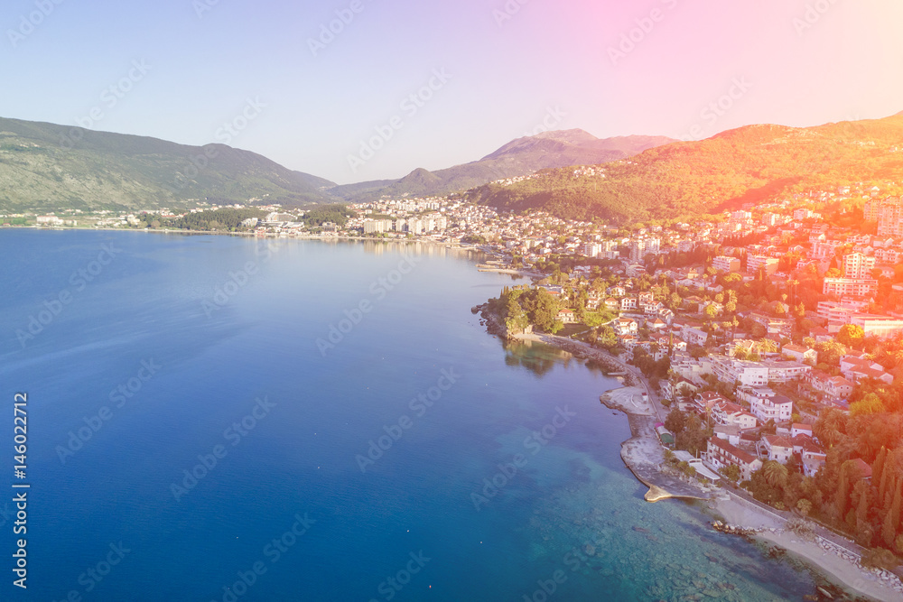 Top view of a beautiful city near the sea in the sunlight