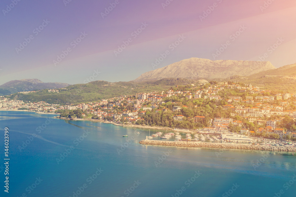Top view of the beautiful city on the seashore in the sunlight
