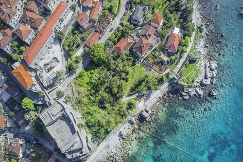 Top view of houses with red roofs near the sea photo