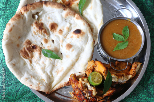 North Indian cuisine, Cheese Naan with Tandoori chicken photo