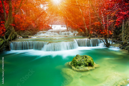 Amazing waterfall in autumn forest 