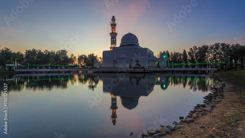 beautiful view of sunrise at The Tengku Tengah Zaharah Mosque or the Floating Mosque, Kuala Ibai, Terengganu. Malaysia photo