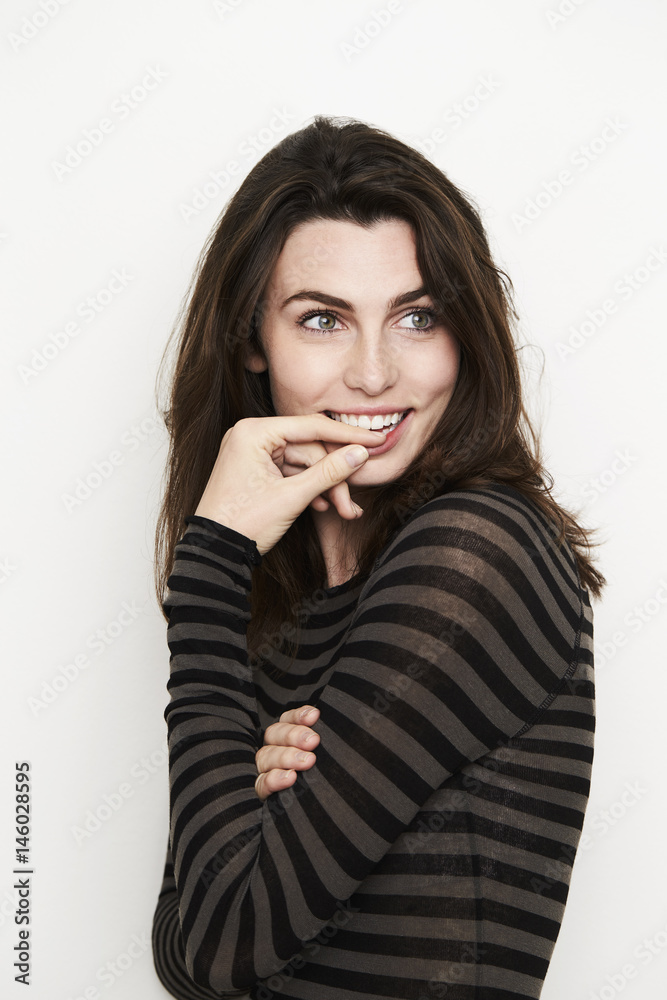 Beautiful woman in striped top, looking away Beautiful woman in striped top, looking away