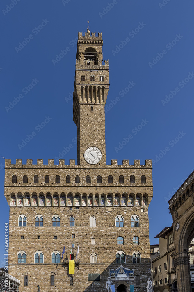 Detail of the famous Palazzo Vecchio palace in Piazza della Signoria in Florence, Italy, on a sunny day