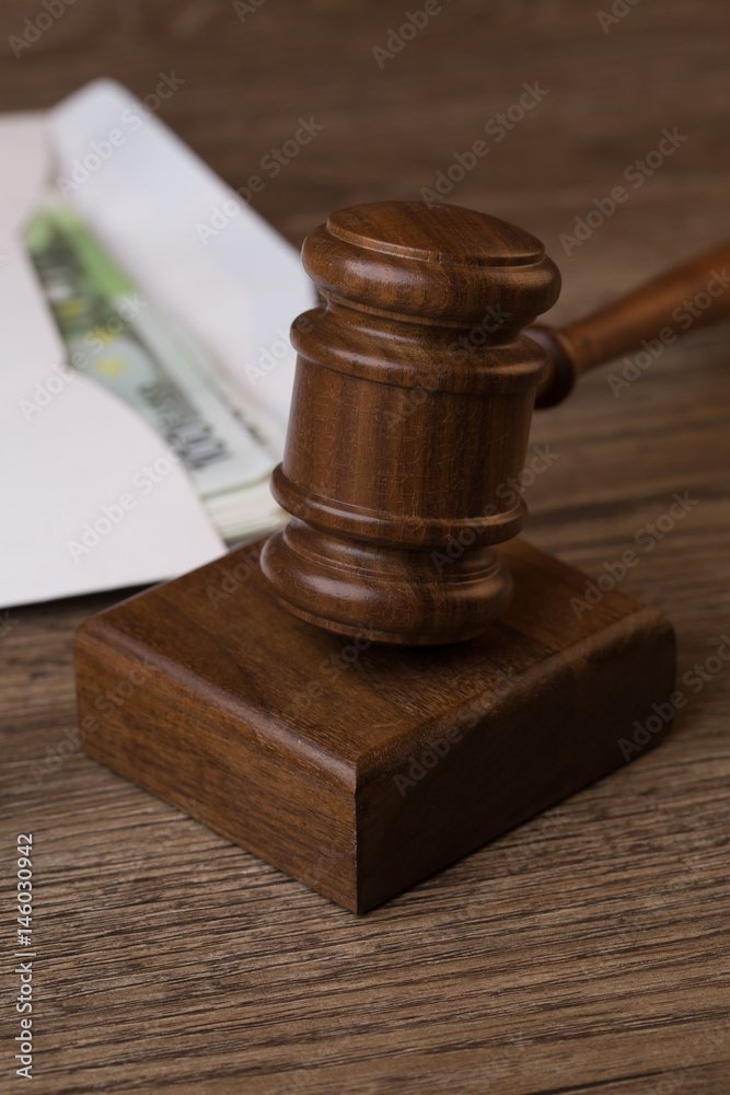 Wooden table with hammer, money