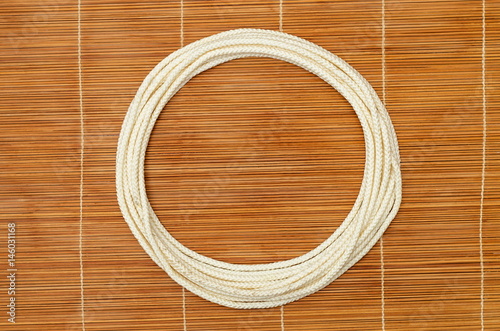 Rope ring, on a wooden background