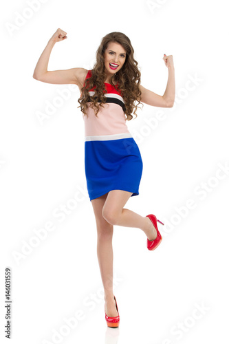 Happy Woman In High Heels And Mini Dress Cheering