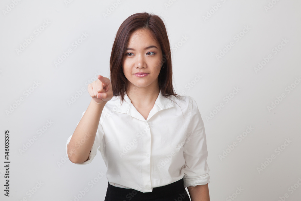 Asian woman touching the screen with finger. Asian woman touching the screen with finger.