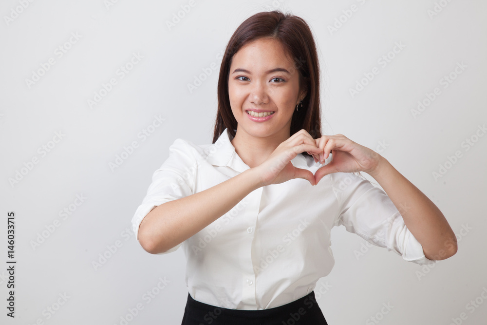 Young Asian woman show heart hand sign. Young Asian woman show heart hand sign.