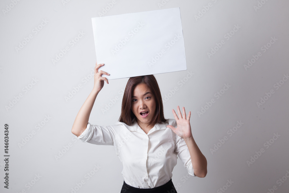 Young Asian woman surprise with white blank sign. Young Asian woman surprise with white blank sign.