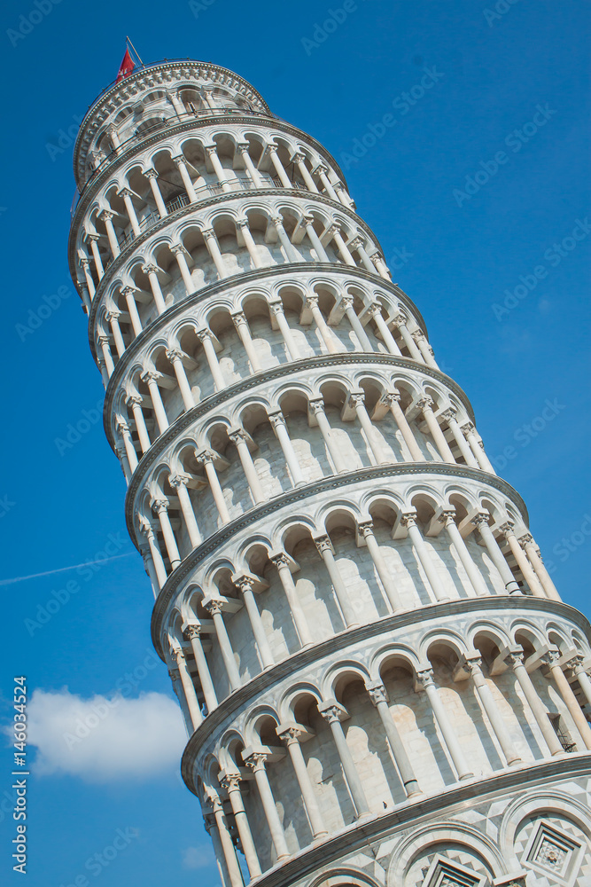 Leaning tower in pisa against the blue sky. Vertical photo