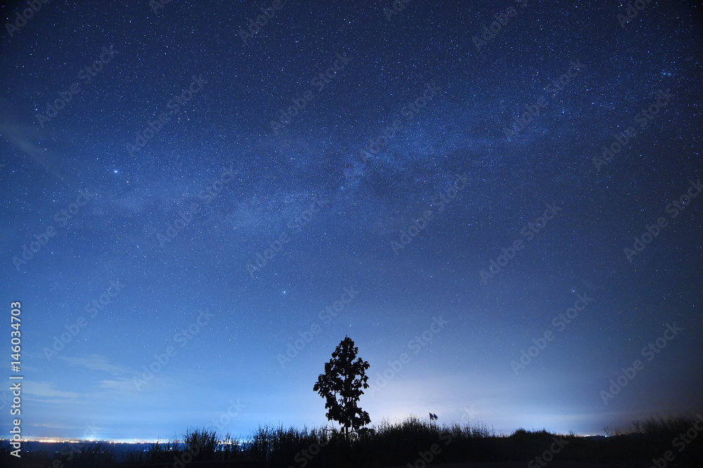 Fototapeta premium Night sky with the Milky Way over the forest and trees,Thailand.