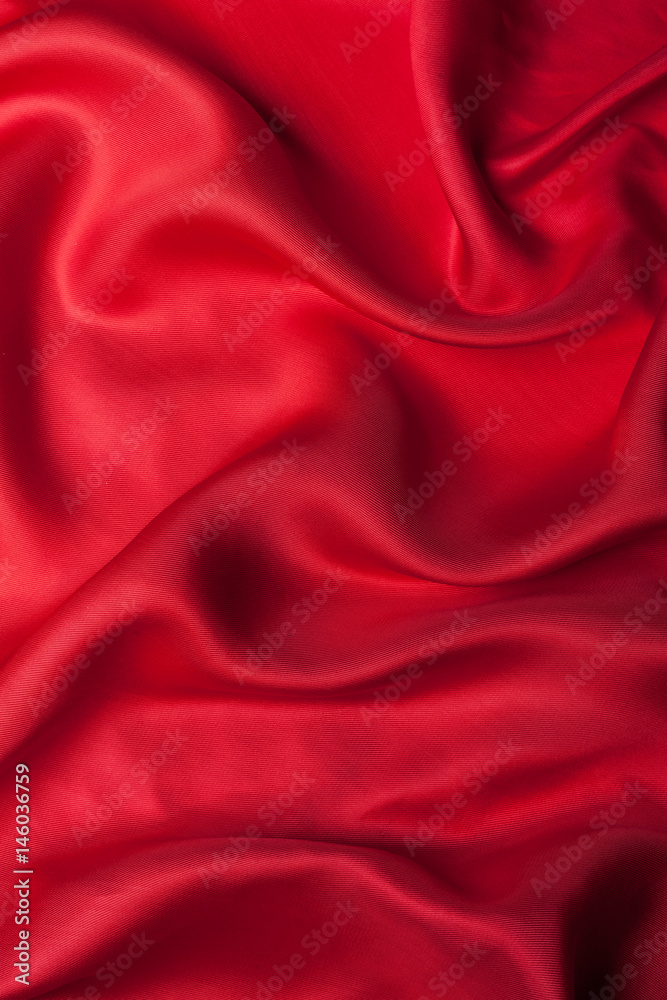 Obraz premium Red cloth waves background texture