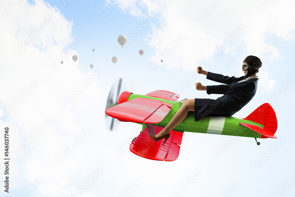Fototapeta premium Woman in drawn airplane . Mixed media