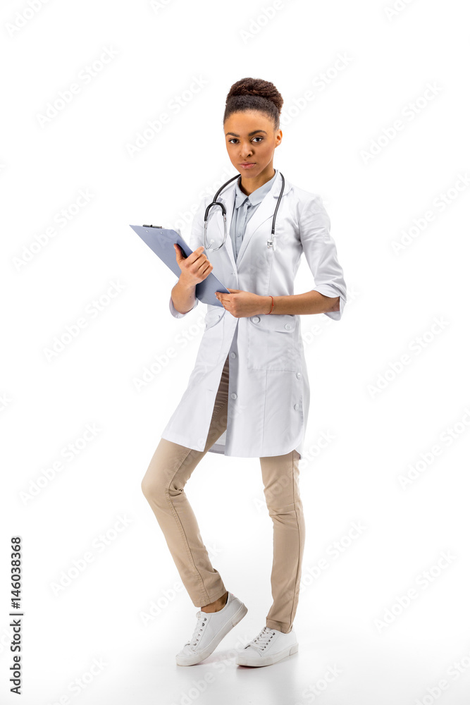 african american female doctor standing with diagnosis isolated on white