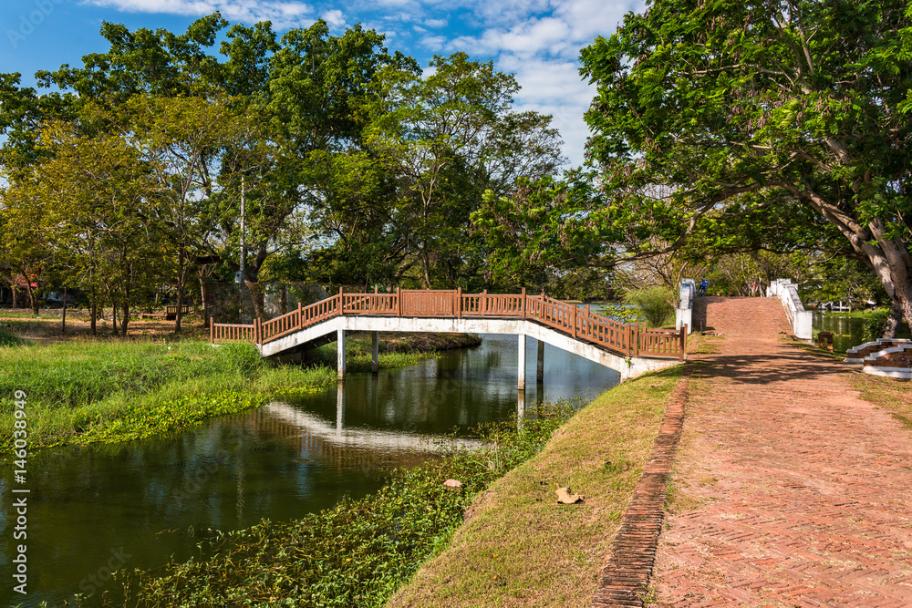Landscape of alley and bridge across canal in Ayutthaya park