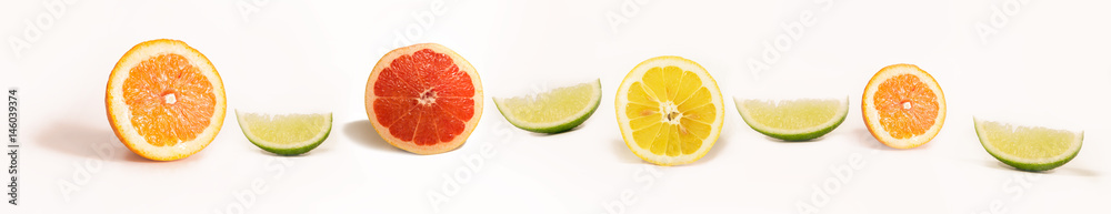 Panoramic Bright and Fresh Lemon, Orange, Grapefruit, Lime for Skinali. Colorful Citrus Fruit Slices Background. White Backside. Panoramic Bright and Fresh Lemon, Orange, Grapefruit, Lime for Skinali. Colorful Citrus Fruit Slices Background. White Backside.