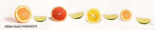 Panoramic Bright and Fresh Lemon, Orange, Grapefruit, Lime for Skinali. Colorful Citrus Fruit Slices Background. White Backside.
