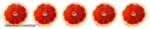 Bright and Fresh Grapefruit Slices in a Panoramic Image