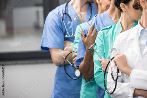 partial view of group of medical workers with equipment in laboratory