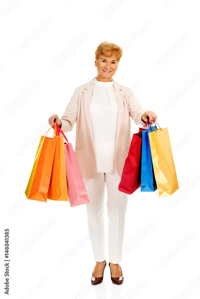 Happy business woman holging shopping bags Happy business woman holging shopping bags