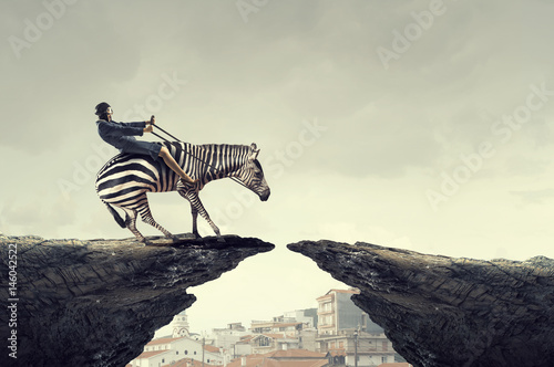 Businesswoman ride zebra