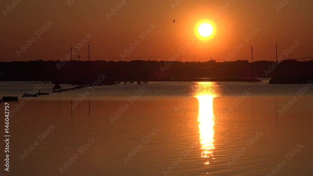 orange lagoon at sunset in spring orange lagoon at sunset in spring