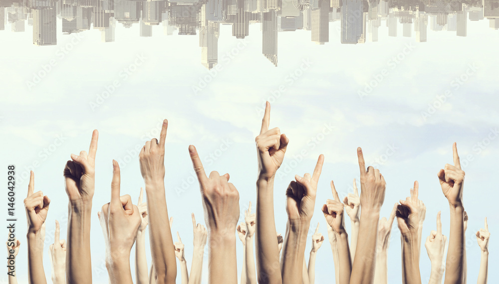 Group of people rise hands