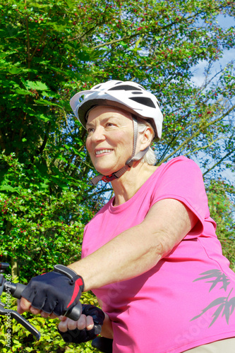 senior woman bicycle helmet gloves