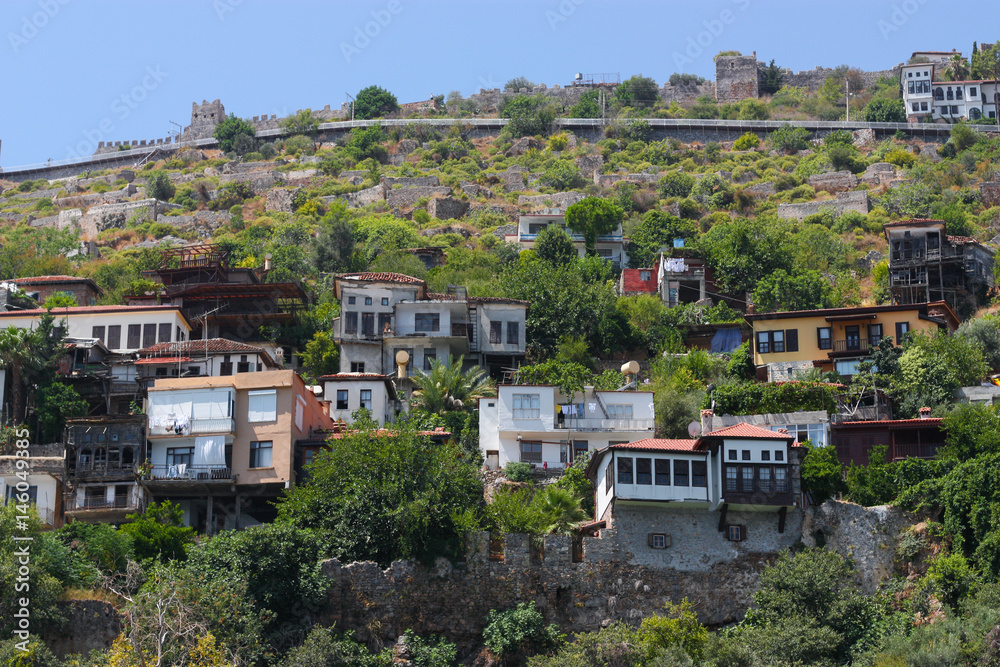 View of the colored houses on the hill among the greenery.