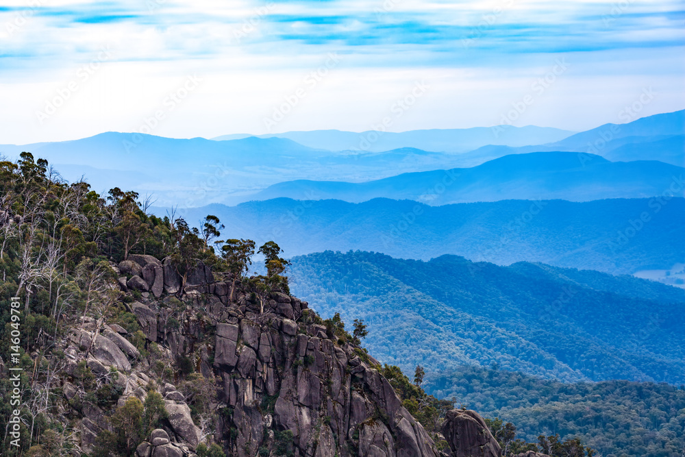 Mount Buffalo National Park - Rocks and layers of blue hills. Victoria, Australia