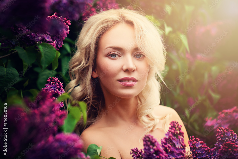 Smiling Woman Fashion Model Outdoors. Pretty Face, Blonde Hair and Flowers Smiling Woman Fashion Model Outdoors. Pretty Face, Blonde Hair and Flowers