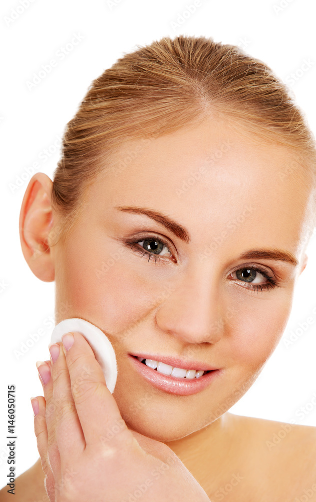 Beautiful woman using cotton pad Beautiful woman using cotton pad