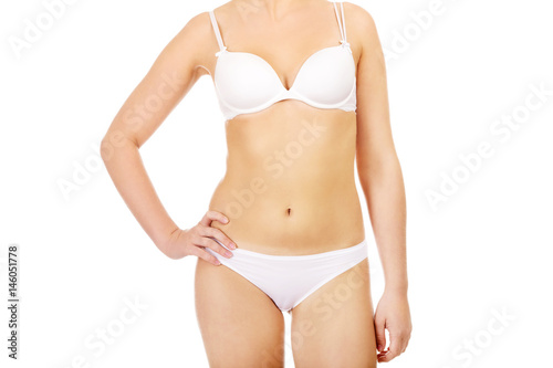 Body of slim woman in white underwear