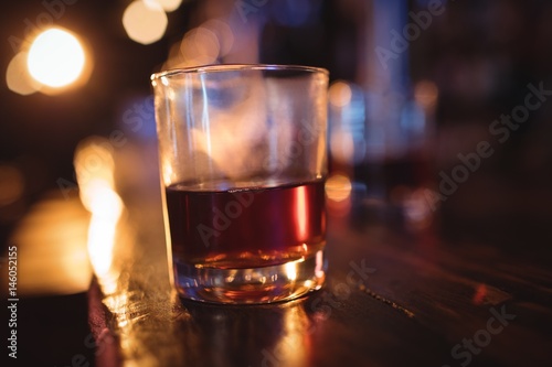 Fototapeta Naklejka Na Ścianę i Meble -  Close-up of whisky glass at counter