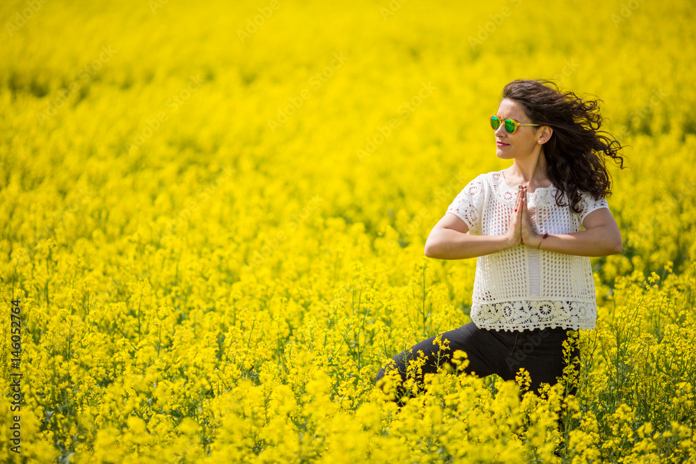 Young lovely brunette with sunglasses, in rapeseed Young lovely brunette with sunglasses, in rapeseed