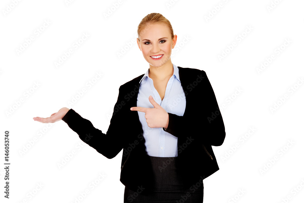 Business woman presenting something on open palm Business woman presenting something on open palm