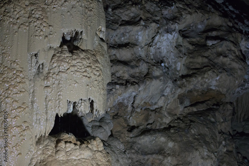 Stalagmite formation in the form of a head in a cave of Abkhazia photo