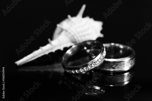 Gold wedding ring and shell photo