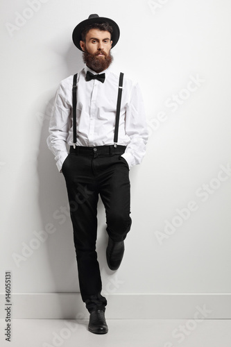 Elegant man with suspenders and a bow tie