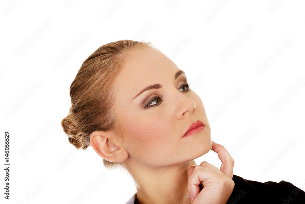 Young worried business woman thinking about something Young worried business woman thinking about something