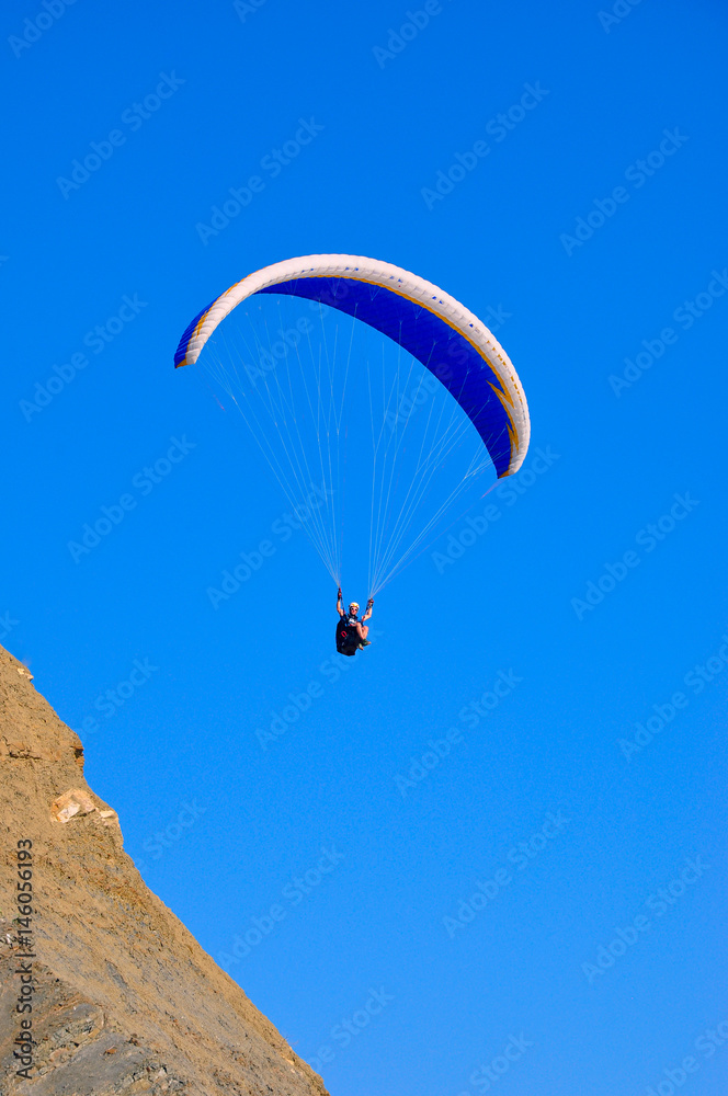 paraglider in the air over the mountains paraglider in the air over the mountains