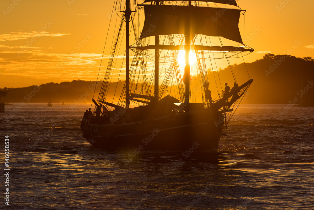 Sailing ship on colorful sunset